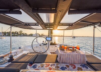 Lagoon 52F flybridge sunset Kos harbour – Stay Salty Sailing, private crewed catamaran charter