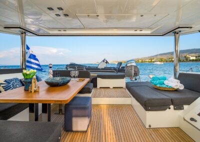 Lagoon 52F cockpit aft view tender greek flag – Stay Salty Sailing, private crewed catamaran charter