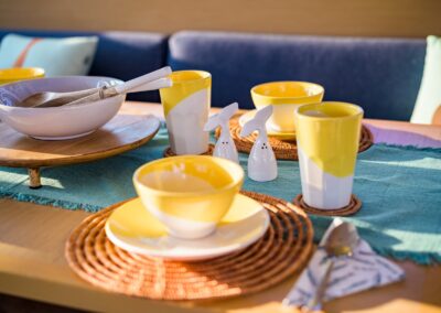 Breakfast table setting saloon wide – Stay Salty Sailing, private crewed catamaran charter