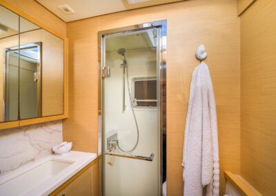 Lagoon 52F guest bathroom shower bathrobe – Stay Salty Sailing, private crewed catamaran charter